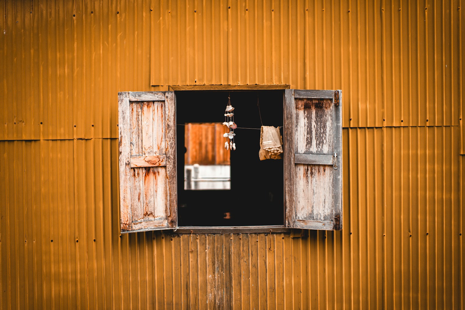 an open window on the side of a building